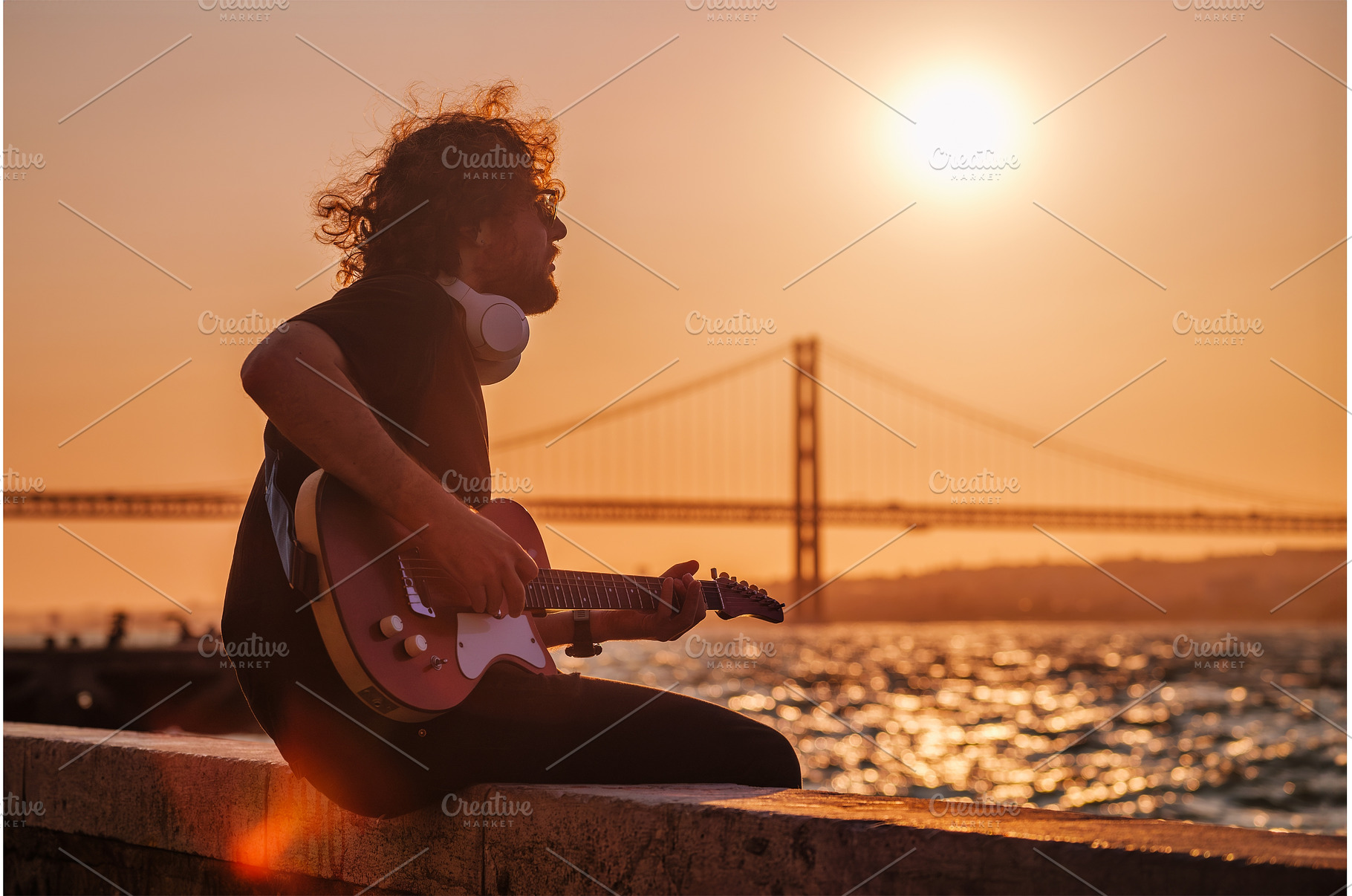 Street musician playing electric, a Person Photo by f9photos