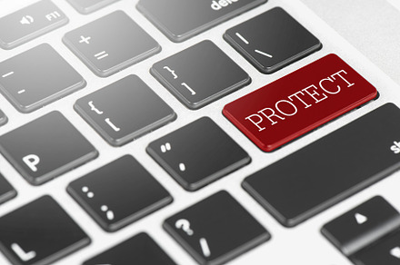 PROTECT Red button keyboard on laptop computer for Business an, a Technology Photo by Ministocker