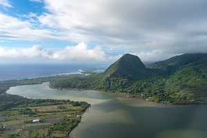 Aerial view of Huahine island, French Polynesia, with lush mount, a Nature Photo by GoodGoods