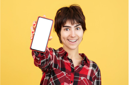 Androgynous person showing a blank, a Person Photo by Iván Moreno STOCK PHOTO