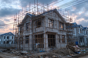 House under construction sunset sky, a Photo by Pixeness Studio