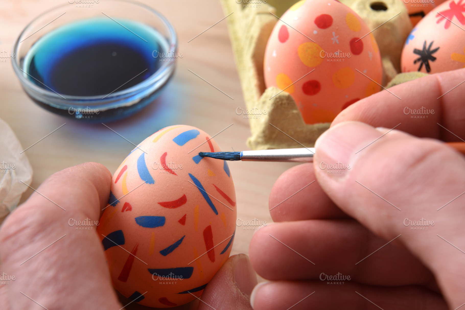 Person Painting Colorful Easter Egg Close Up, a Holiday Photo by Davizro's Market
