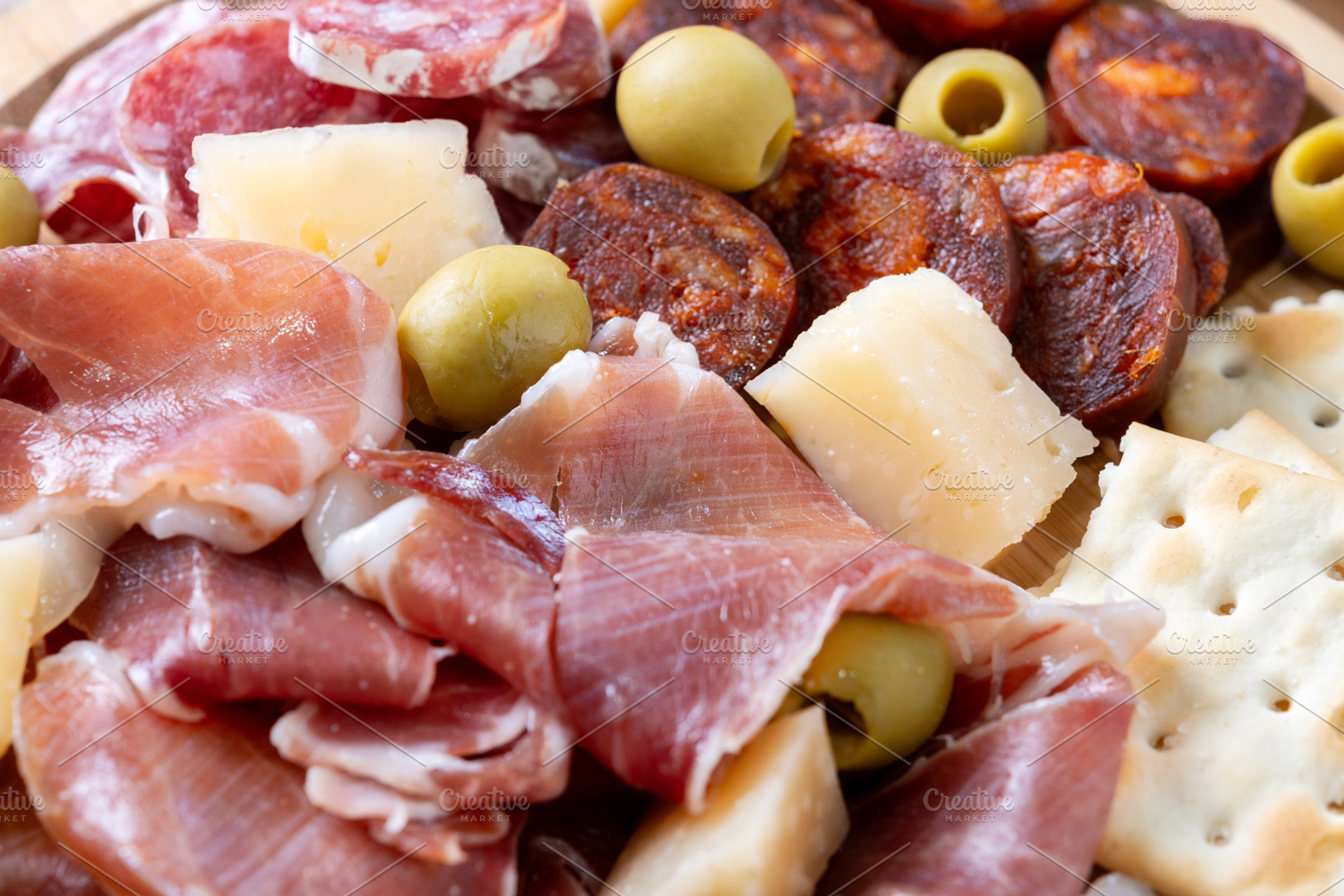 Spanish charcuterie platter with cured meats, cheese and olives, a Food & Drink Photo by etorres69