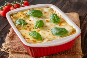 Rustic Lasagna Bolognese In Ceramic Baking Dish With Golden Chee, a Food & Drink Photo by Alexander Prokopenko