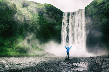 Man near waterfall featuring iceland, nature, and water, a Nature Photo by Nature and travel