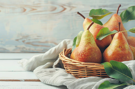 Red pears with green leafs in basket on wooden table, a Food & Drink Photo by AlyaAnd
