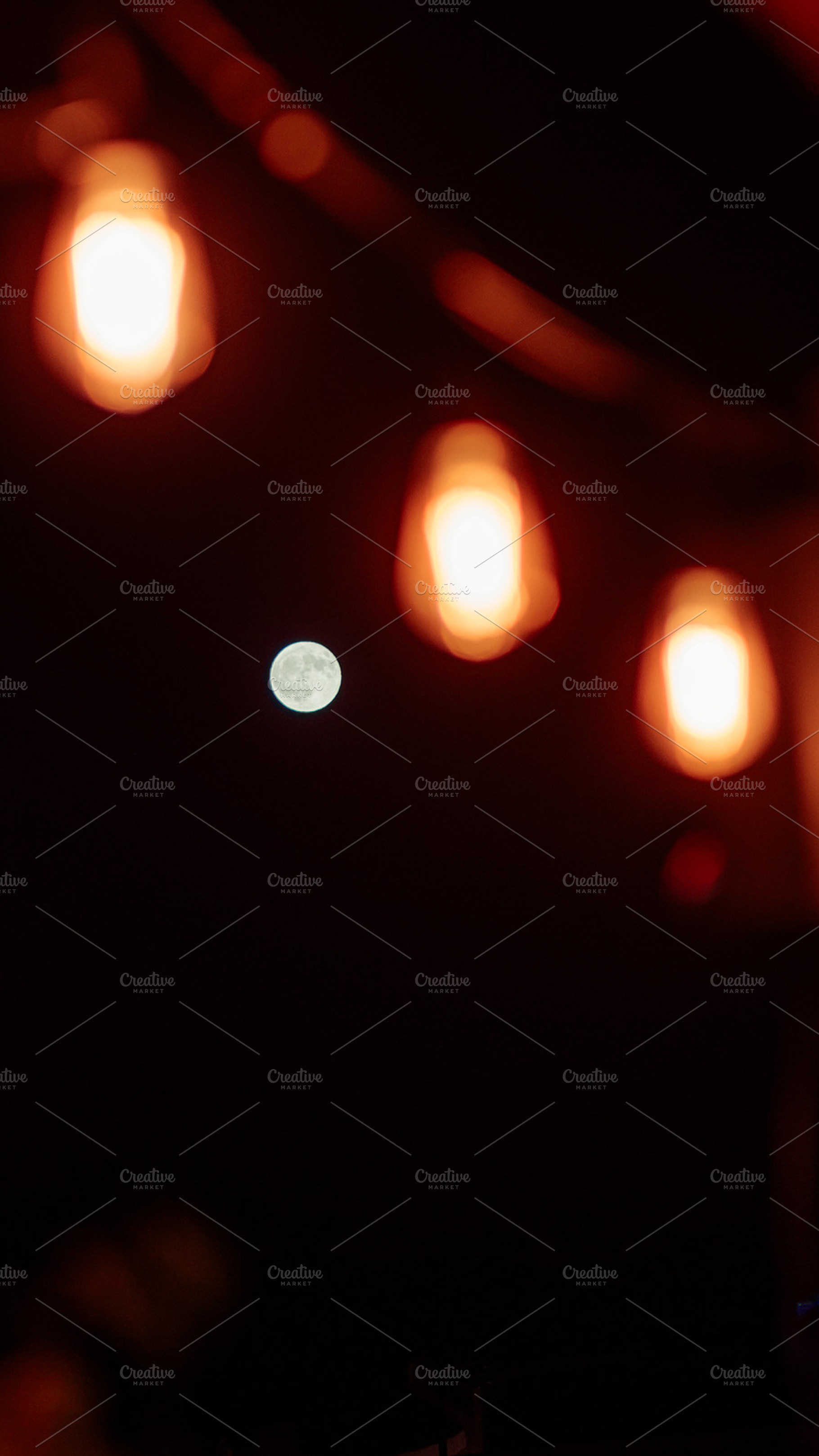 Moon in Focus Behind Blurred Bulbs, a Nature Photo by SkyNext