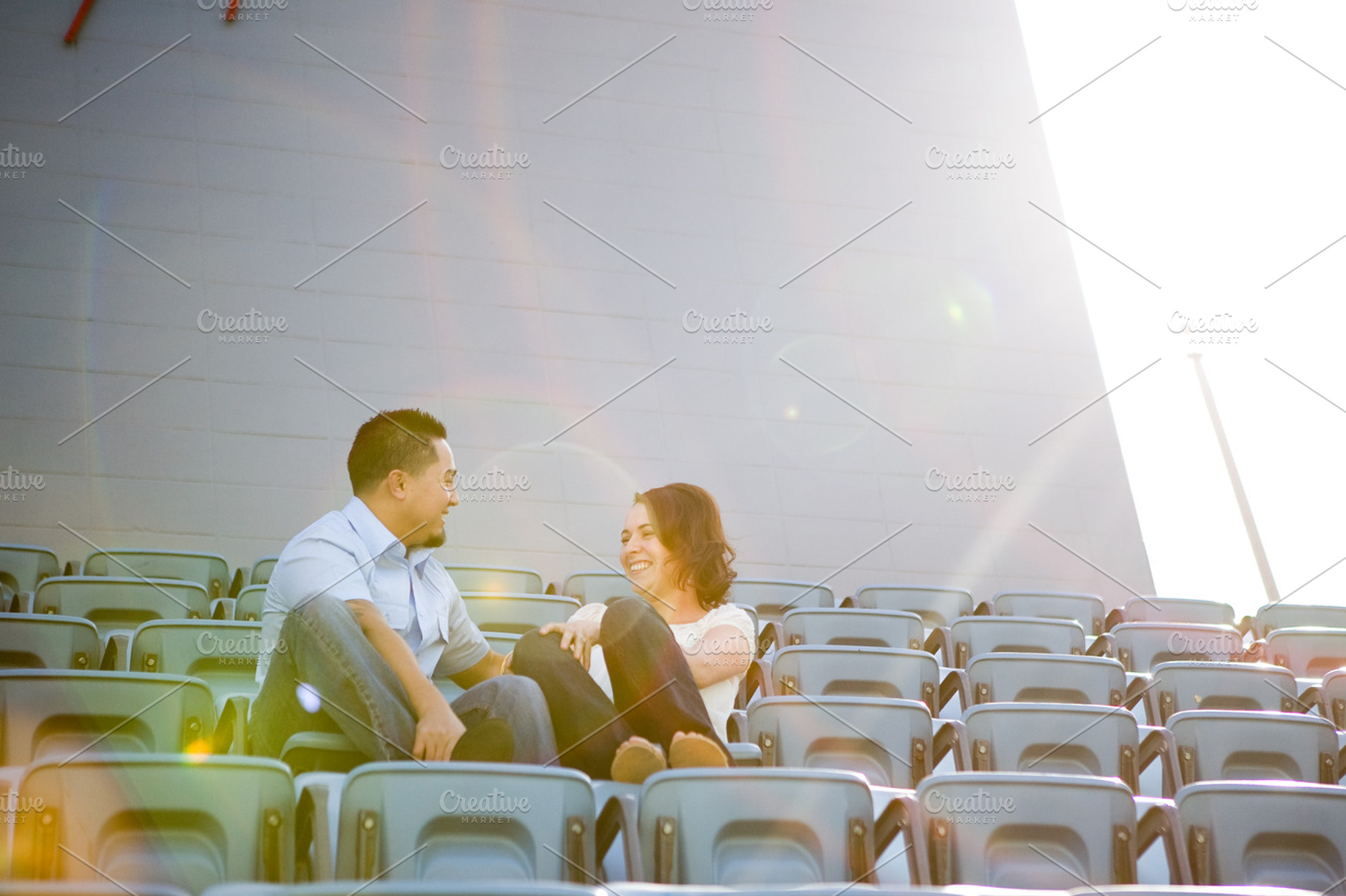 Engagement Couple in Baseball Stand