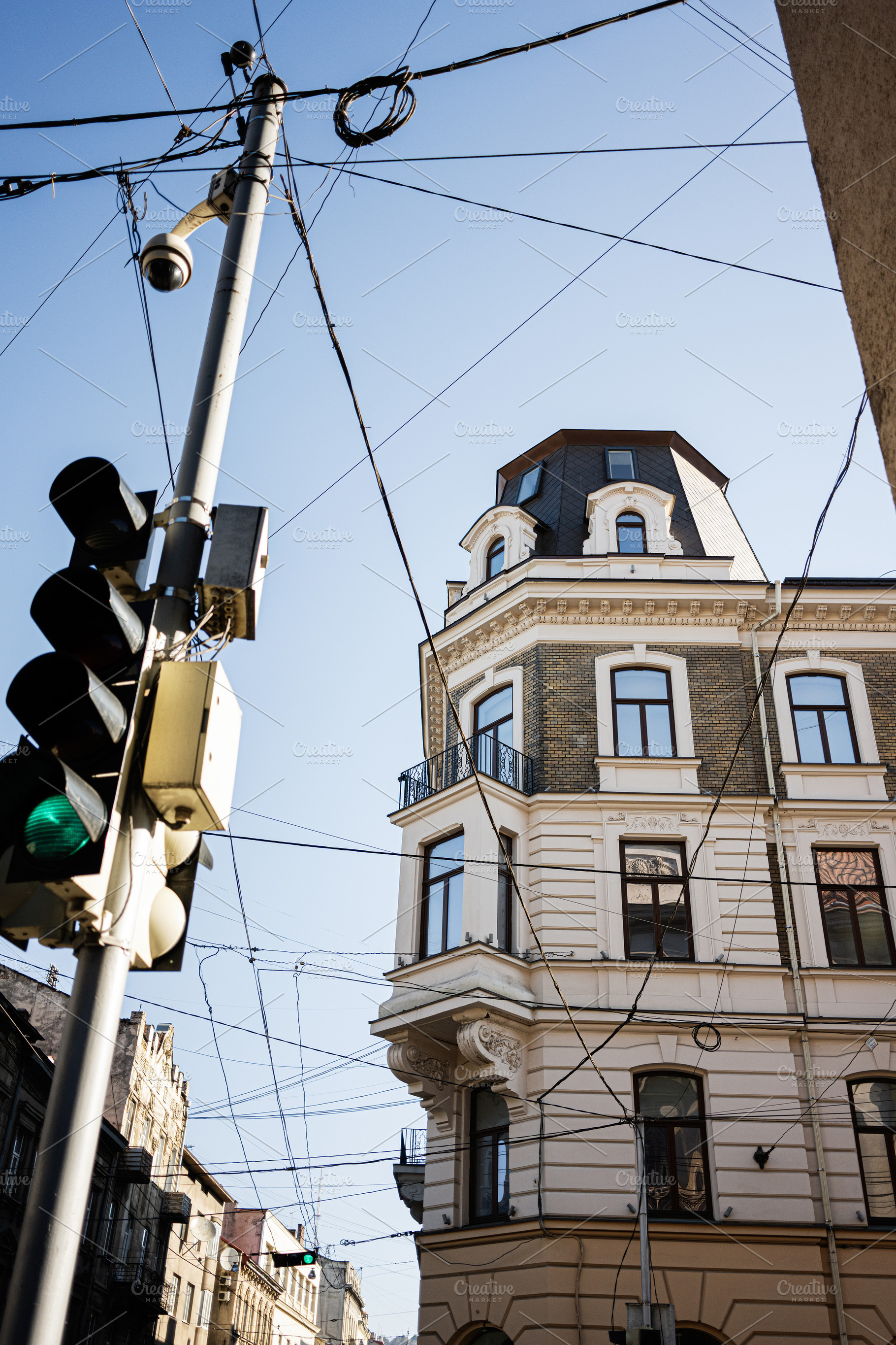 Classic architecture and street elements in Lviv with clear blue skies, a Photo by AS photostudio