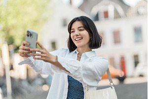 Snap moment. Multiethnic woman with, a Person Photo by AD Stock Images