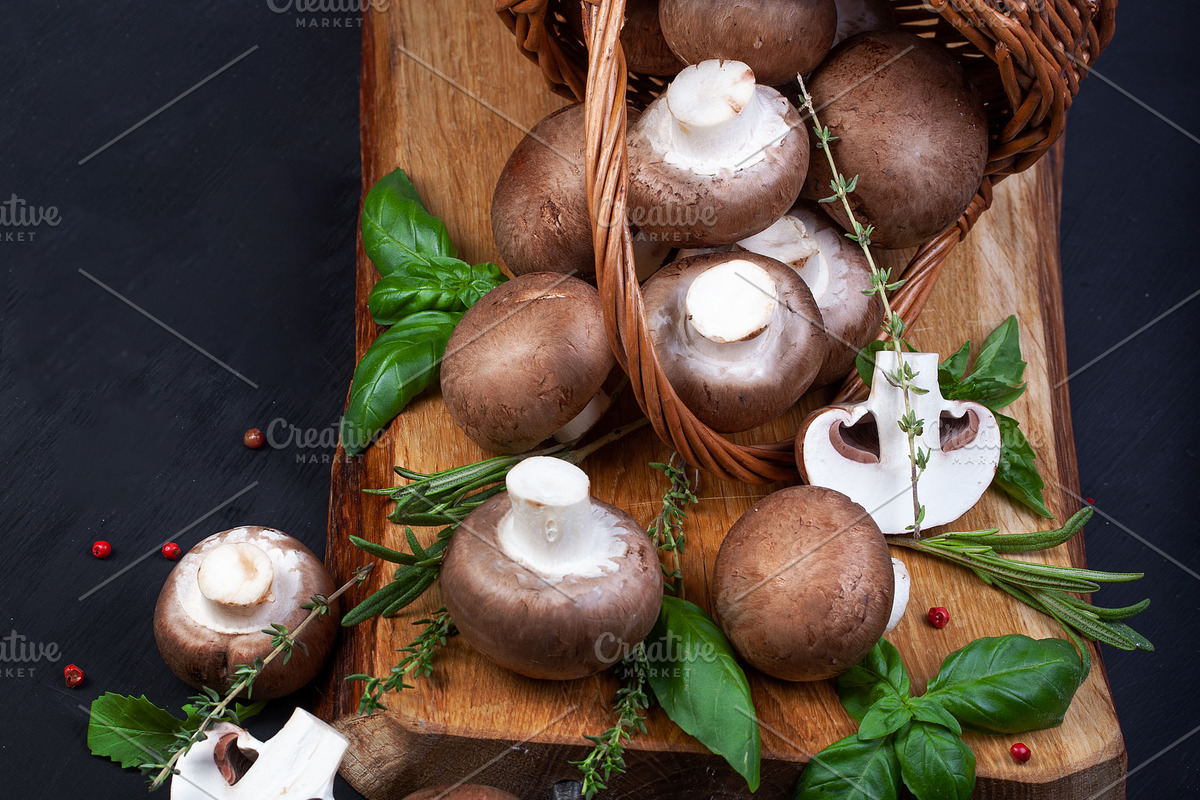 Fresh champignon mushrooms on dark wooden table, a Food & Drink Photo by eleana (Photo 1 of 3)