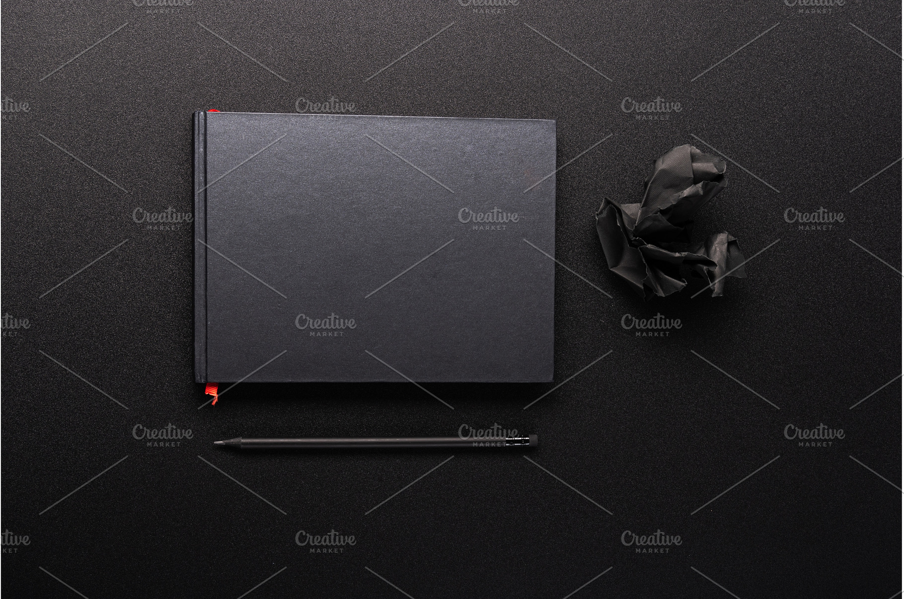 Black notebook with red bookmark, a Background Photo by Stockphoto by vzwer