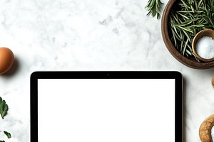 A person holding a tablet iPad mockup with a blank screen, surrounded by fresh, an iPad Mockup by Textures & Backgrounds
