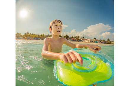 Joyful boy plays in the sea, a Person Photo by Elizaveta Galitskaya