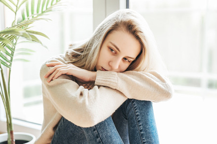 Sad girl near window thinking about something, a Person Photo by Olena Rudo