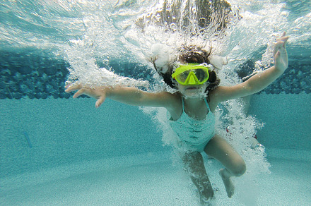 Boy swimming underwater containing bubbles, pool, and water preview 6