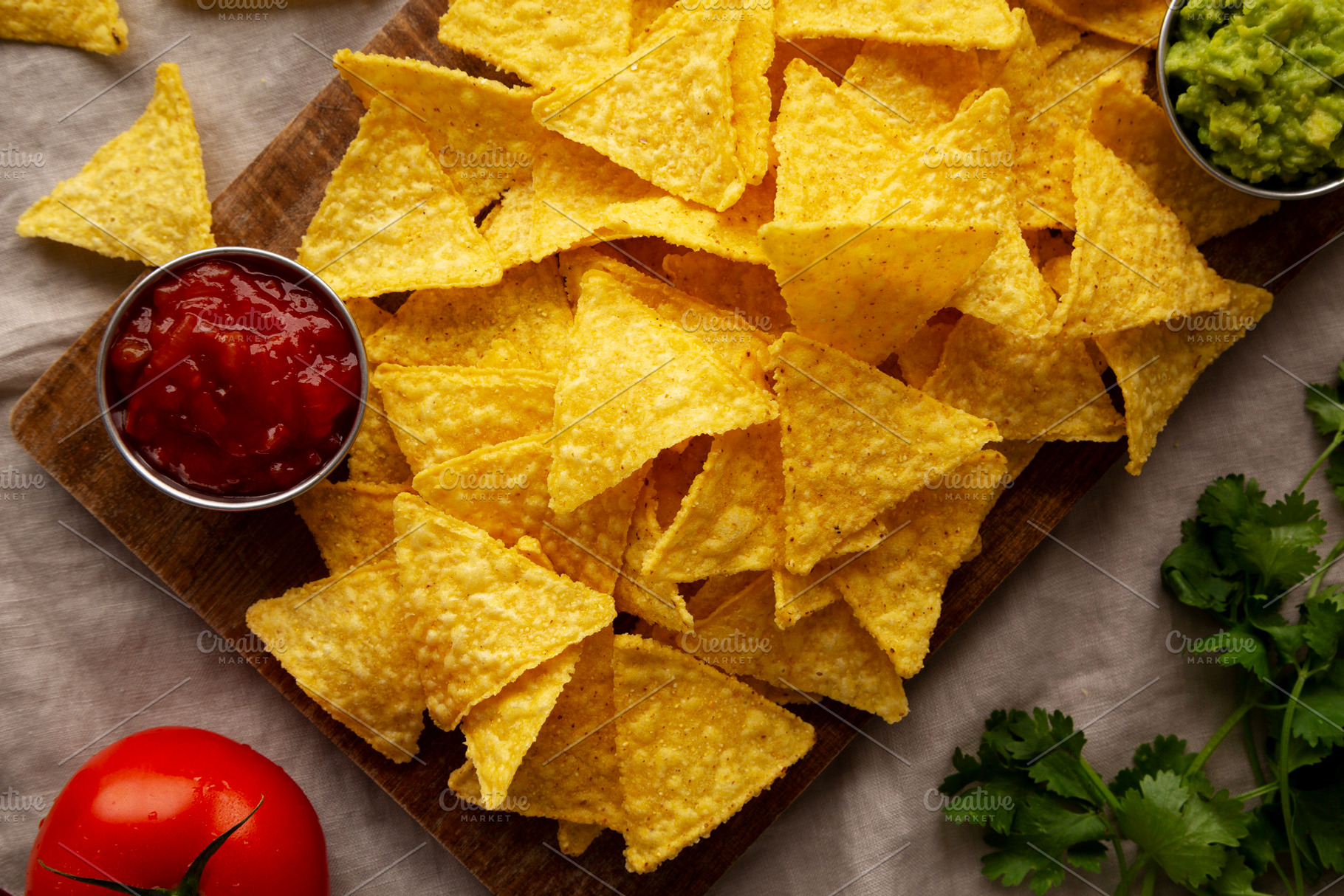 Homemade Corn Tortilla Chips with Tomato Salsa and Guacamole, a Food & Drink Photo by LiudmylaChuhunova