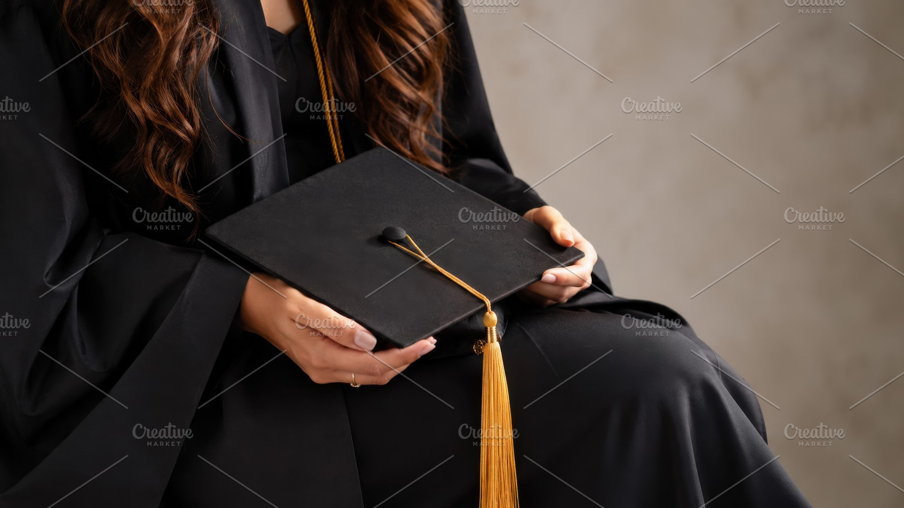 Holding a graduation cap with tassel, a Photo by Beautiful things