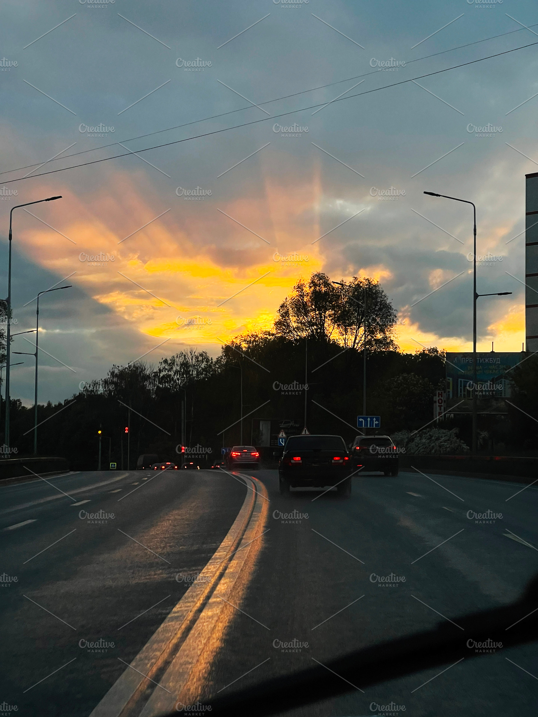Urban road during sunset with beautiful sky and glowing horizon, a Photo by AS photostudio