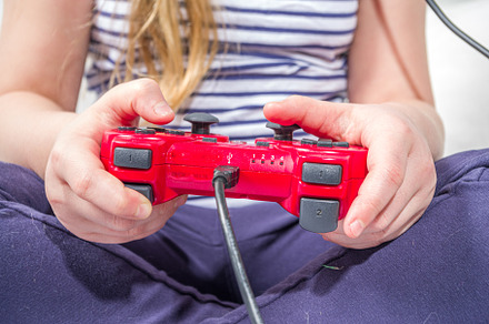 Llittle child kid girl playing video games, a Photo by Rimma