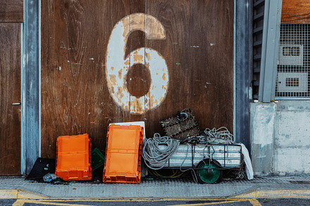 Fishing cart and plastic crates in f