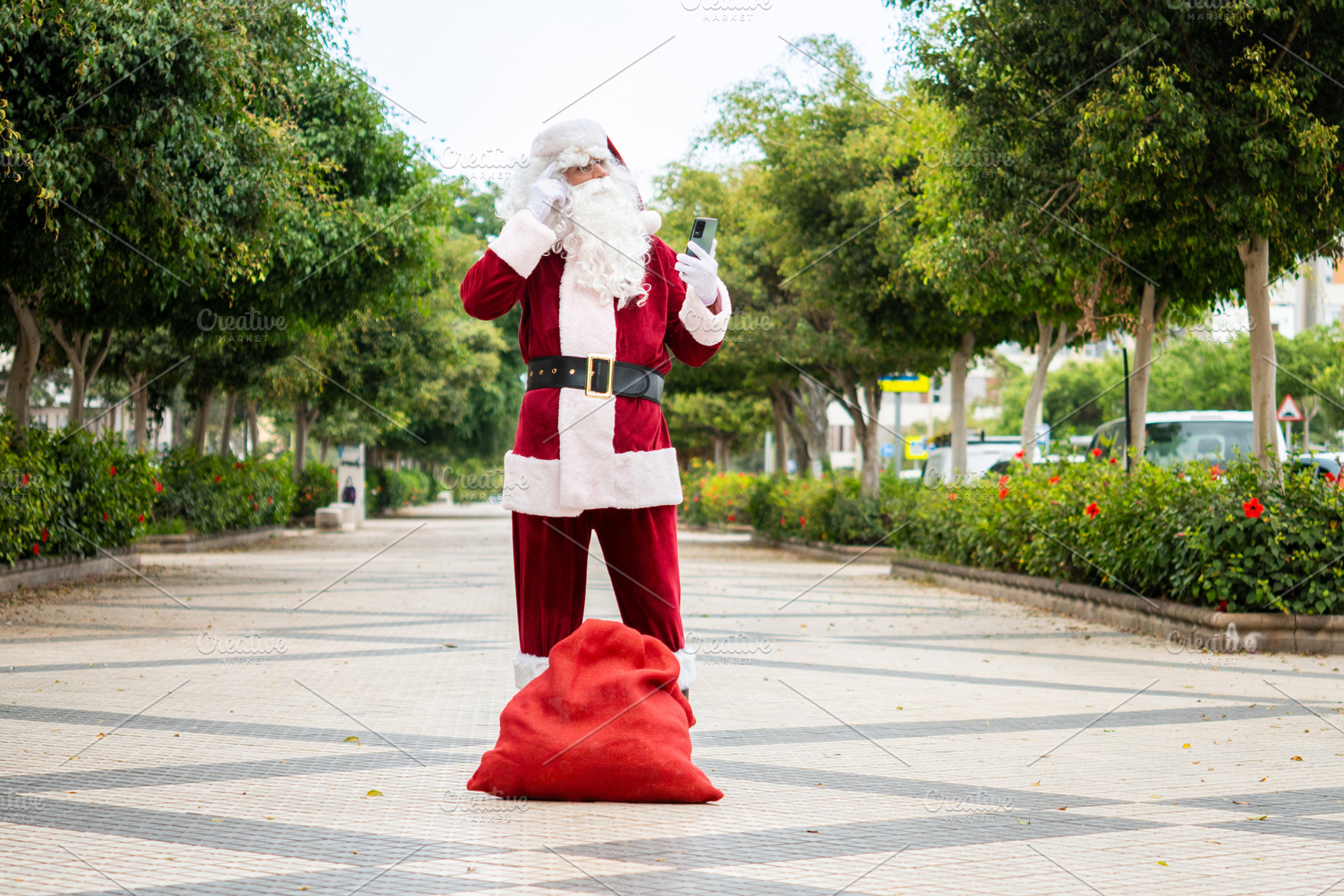 Lost Santa Claus checking smartphone for directions, a Photo by etorres69
