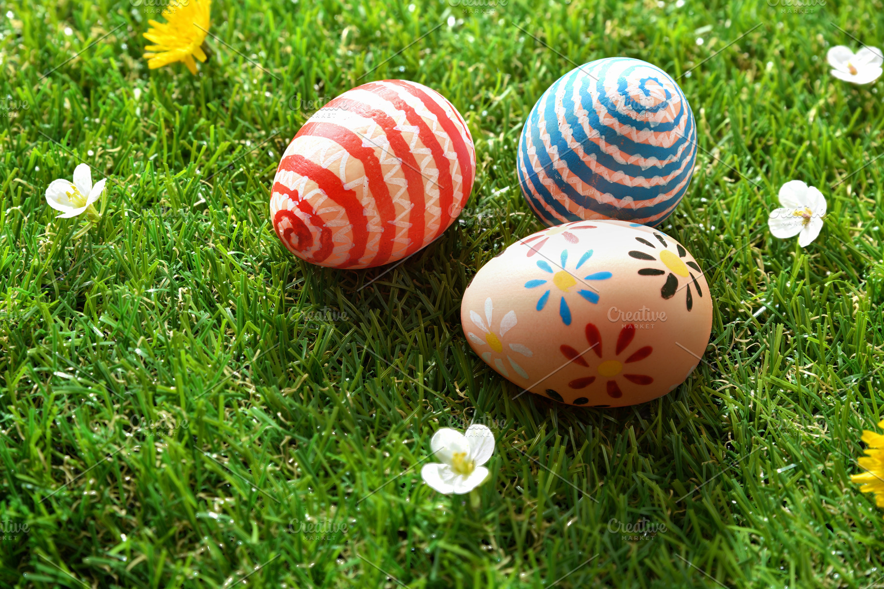 Three Painted Easter Eggs on Green Grass, a Holiday Photo by Davizro's Market