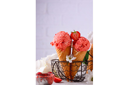 Strawberry ice cream in waffle cone, a Food & Drink Photo by Yulia Furman