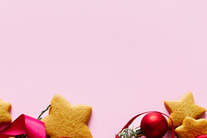 Christmas background with gingerbread cookies, red ribbon and ba, a Photo by Sonjachni