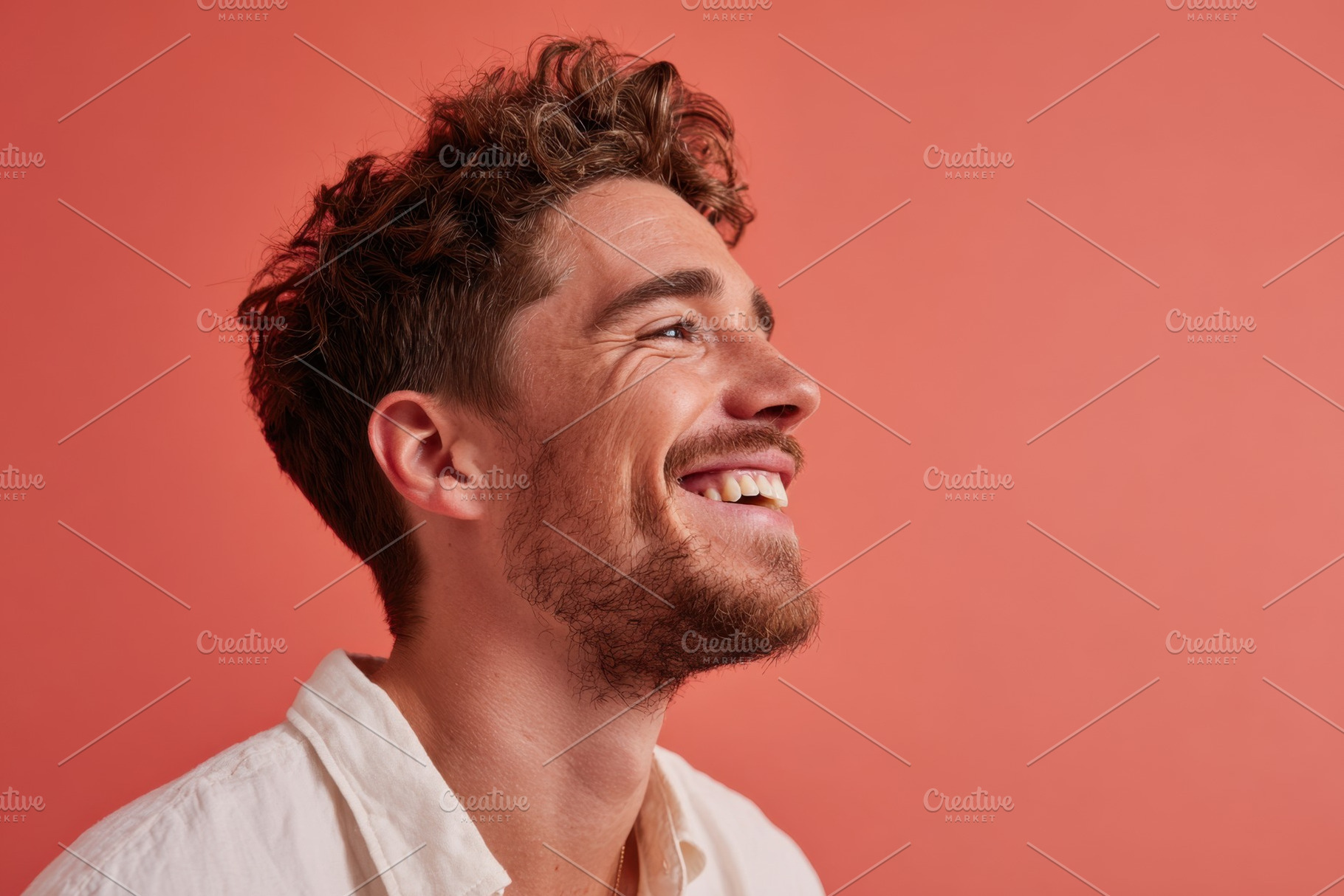 Smiling bearded man looking upwards, a Person Photo by AlyaAnd