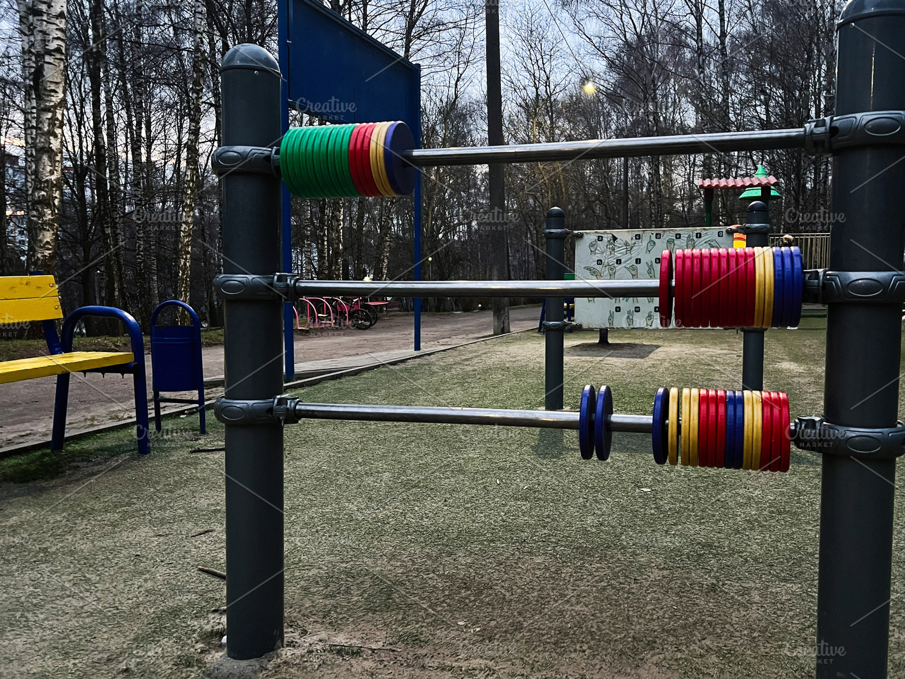 Children outdoor playground with colorful educational equipment during late eve, a Photo by AS photostudio