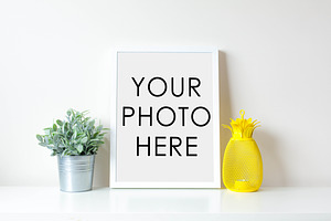 White Frame With Pineapple and Plant