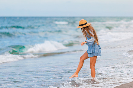 Happy girl enjoy summer vacation on the beach