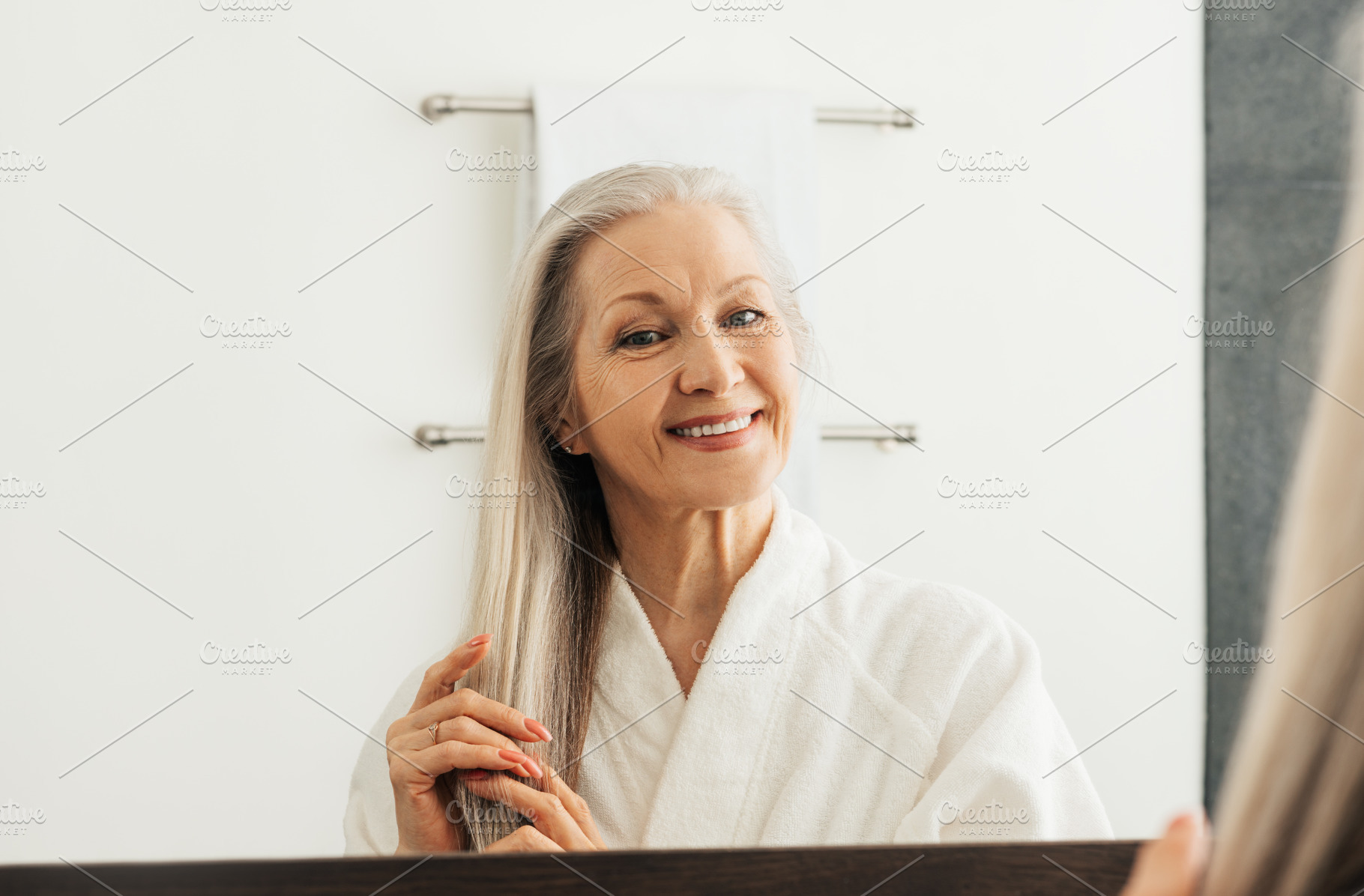 Cheerful senior woman with grey hair, a Person Photo by Artem Varnitsin