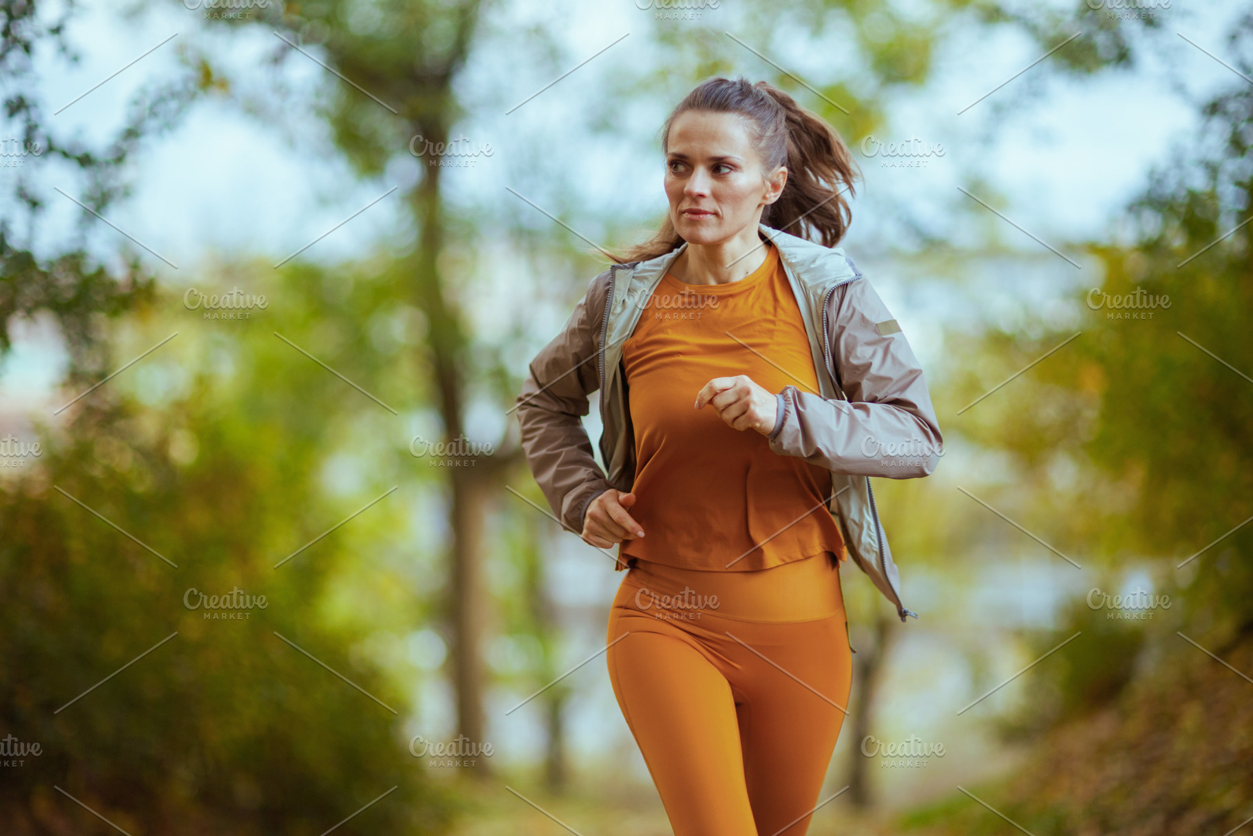 fit woman in fitness clothes in park running, a Sports & Recreation Photo by Alliance Images