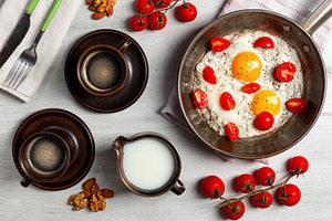Delicious Breakfast with Fried Eggs, Cherry Tomatoes and Coffee, a Food & Drink Photo by Antonio Gravante Market