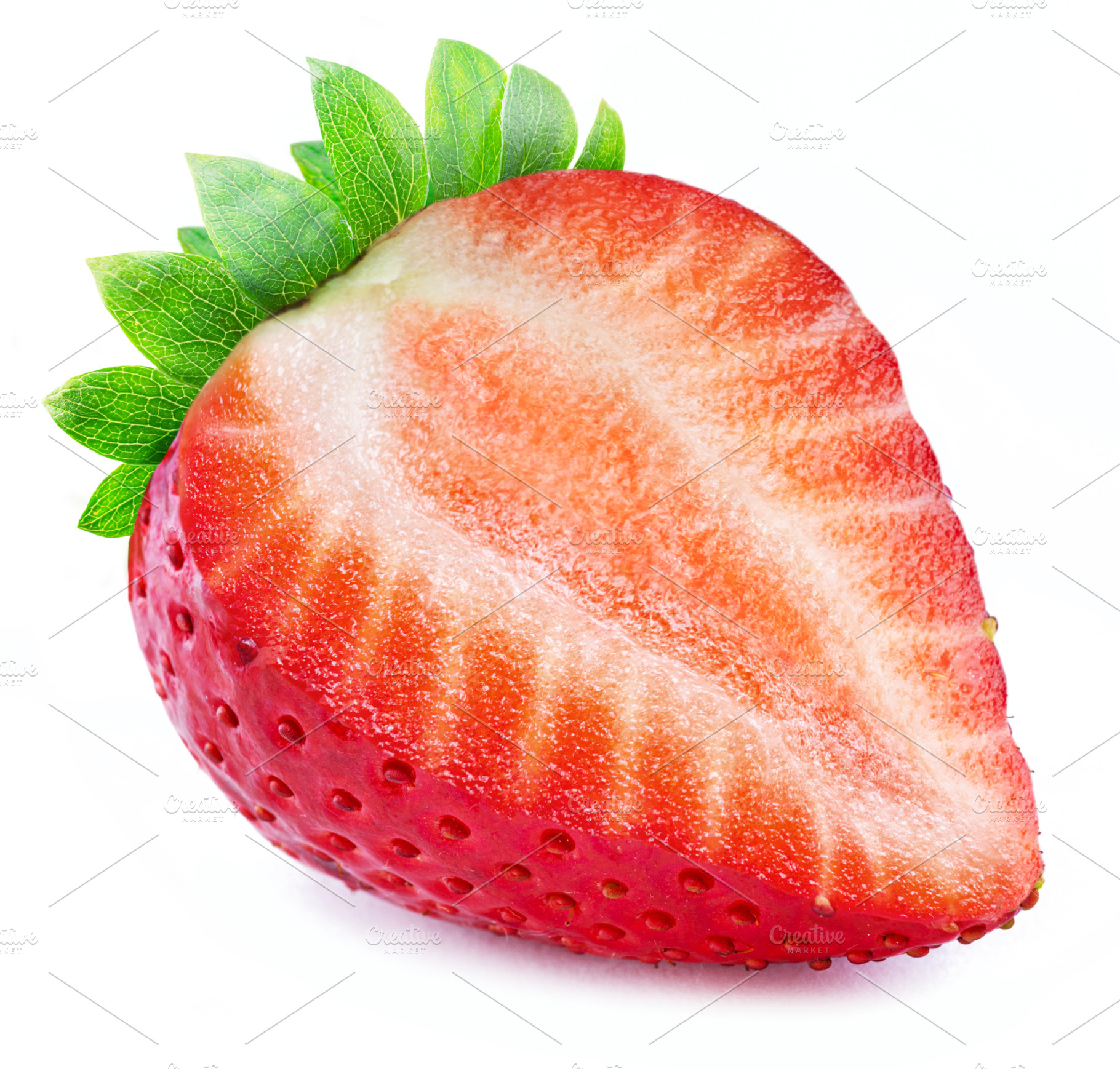 Ripe perfect strawberry cross cut isolated on white background., a Food & Drink Photo by Volff