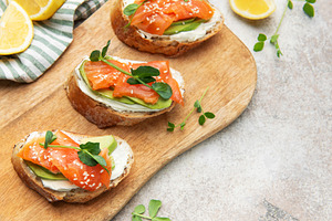 Smoked salmon toast with avocado and cream cheese, a Food & Drink Photo by Olena Rudo