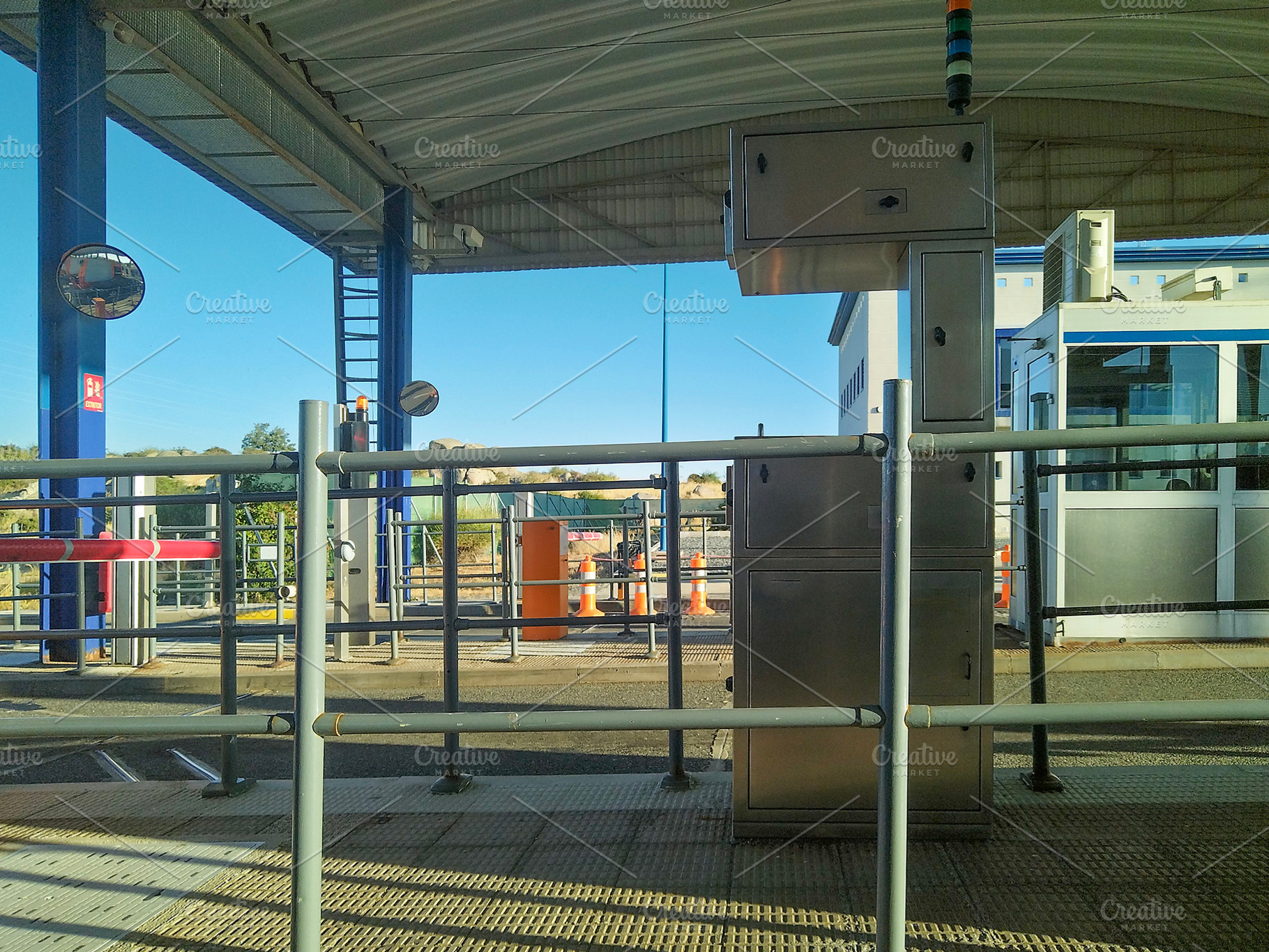 Empty toll booth station under metal canopy, a Transportation Photo by DanFLCreativo