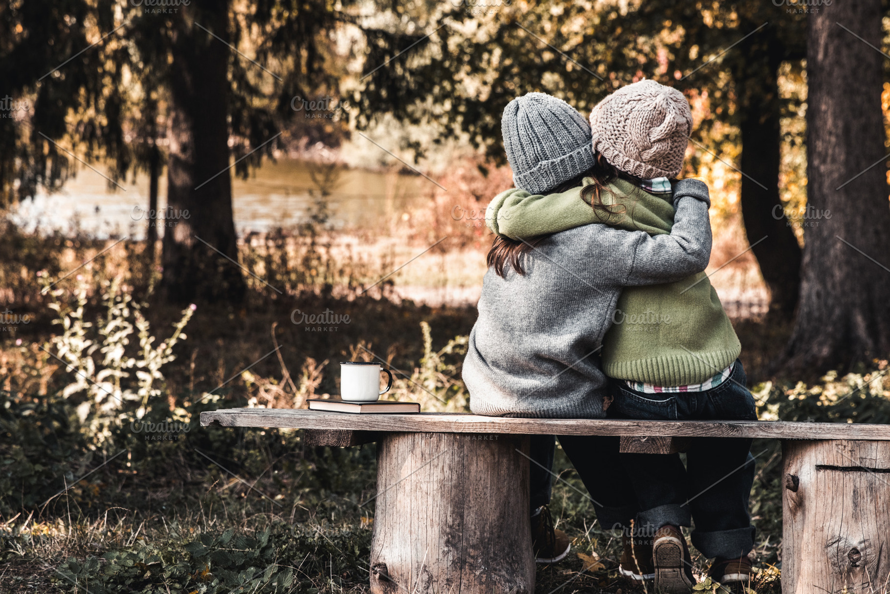 Two happy girls as friends hug each, a Holiday Photo by OS