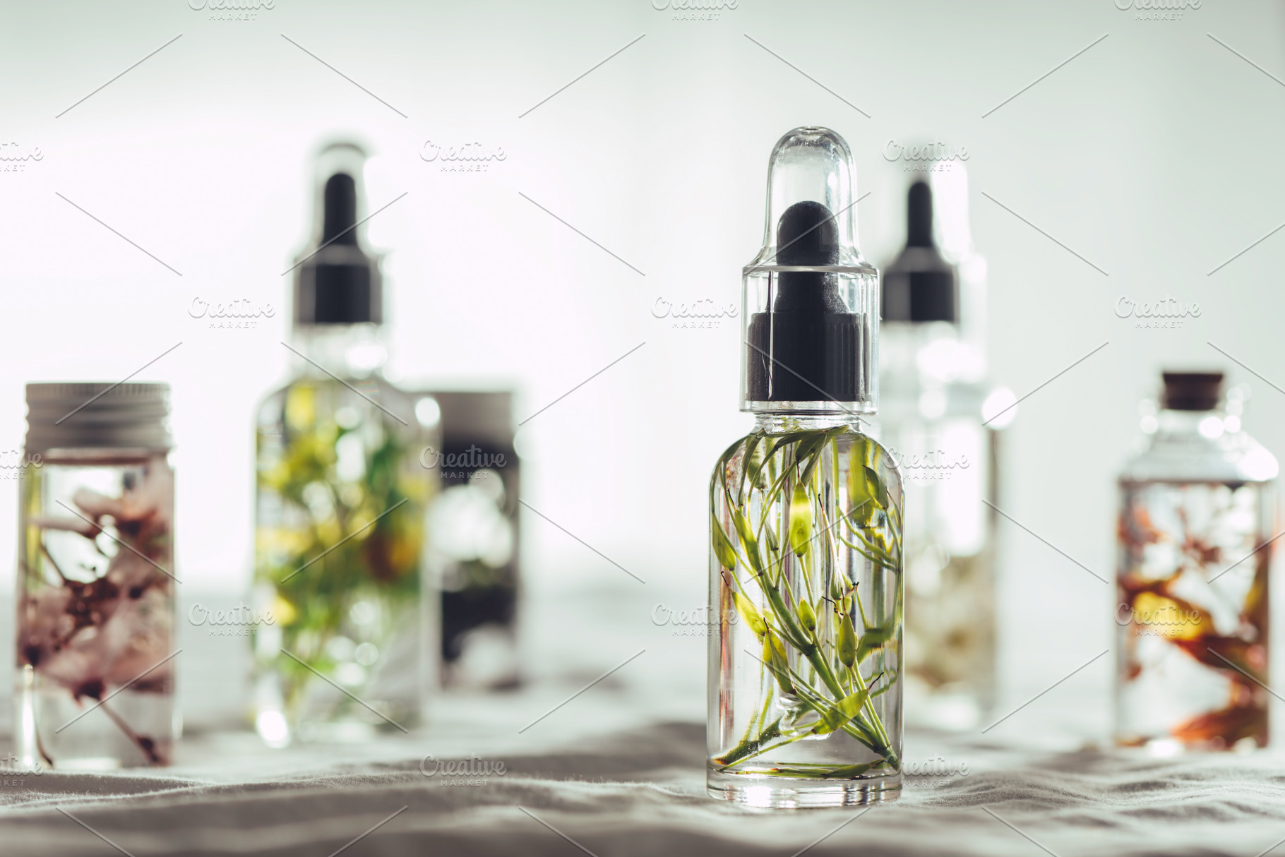 Transparent bottles of essential oil featuring essential, oil, and oils, a Beauty & Fashion Photo by SZ IMAGE
