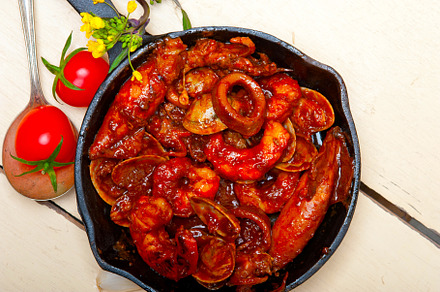 fresh seafoos stew on an iron skillet, a Food & Drink Photo by keko64