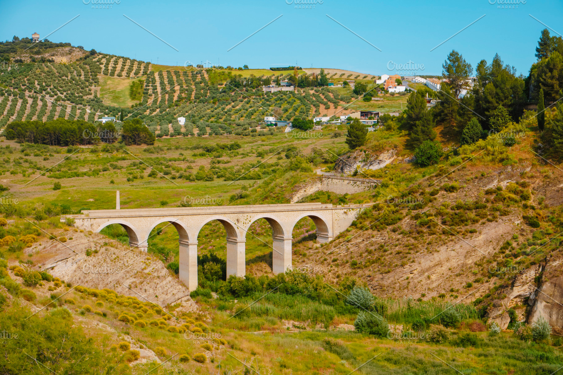 bridge crossing the Priego stream, in Iznajar, a Photo by Nito