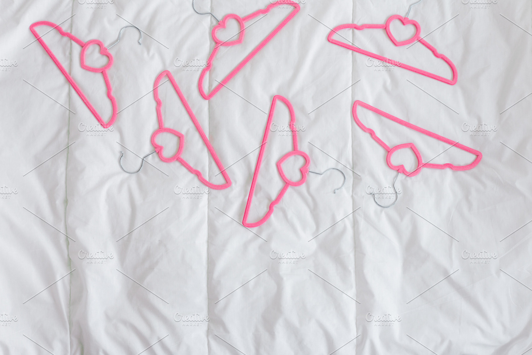 Set of pink velvet clothes hangers, a Beauty & Fashion Photo by Kolomiyets Viktoriya