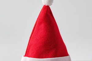 Red Santa hat for festive celebrations, a Holiday Photo by AlyaAnd