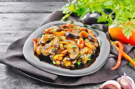 Ragout with eggplant on dark board