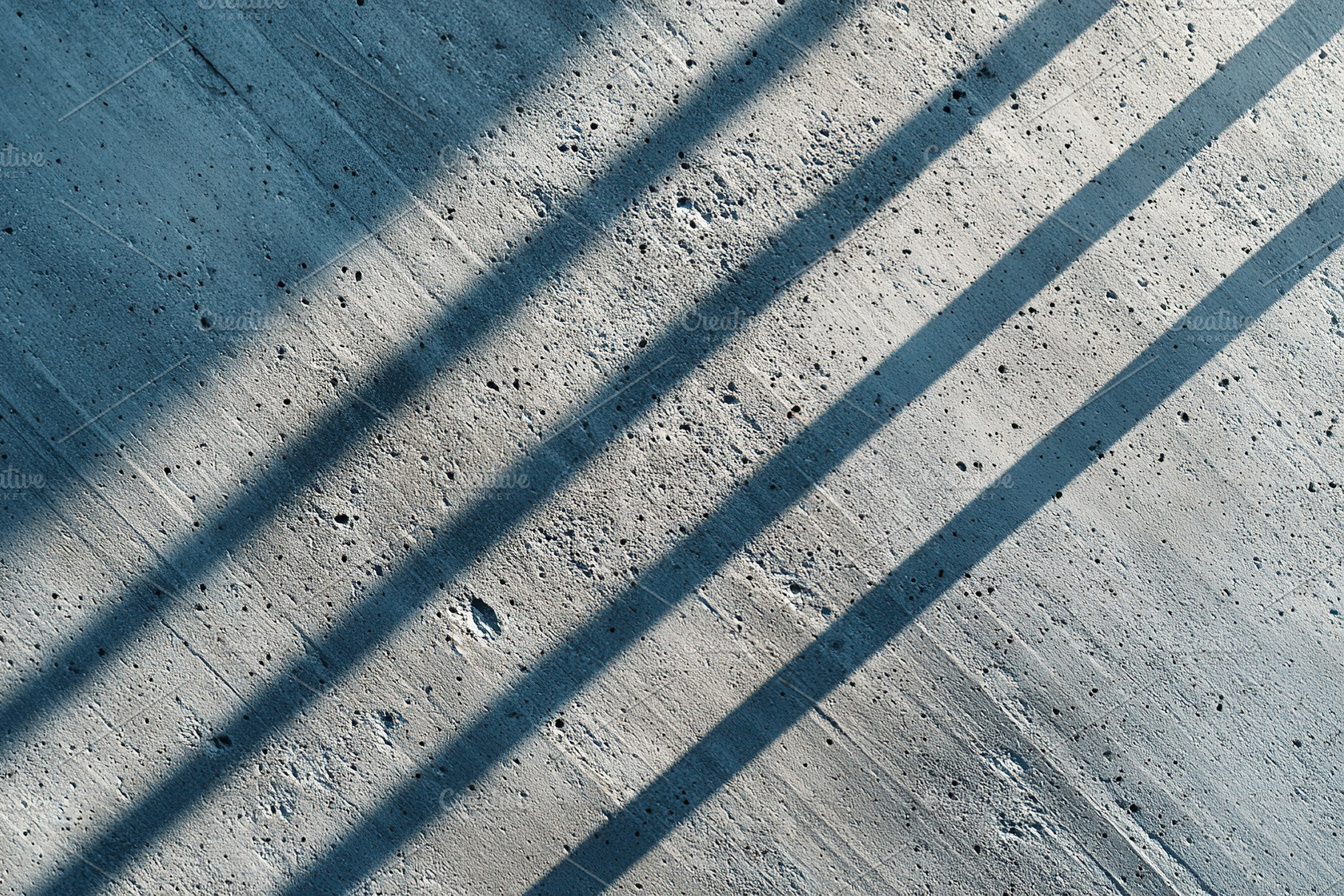 Abstract concrete surface with shadows, an Abstract Photo by AlyaAnd