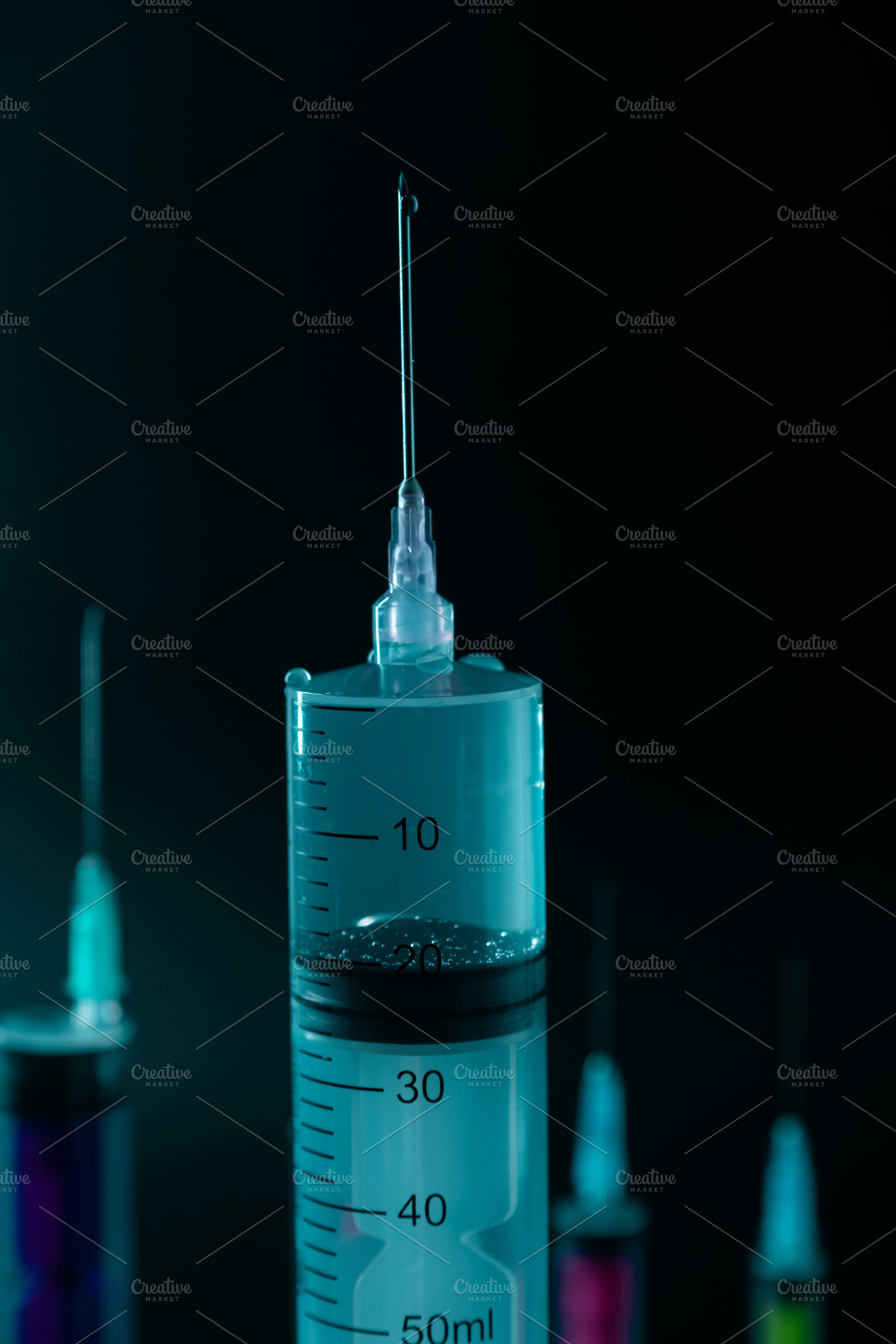 Close-up of Large Medical Syringe and Needle on Dark Background., a Health & Medical Photo by Rohan Photography