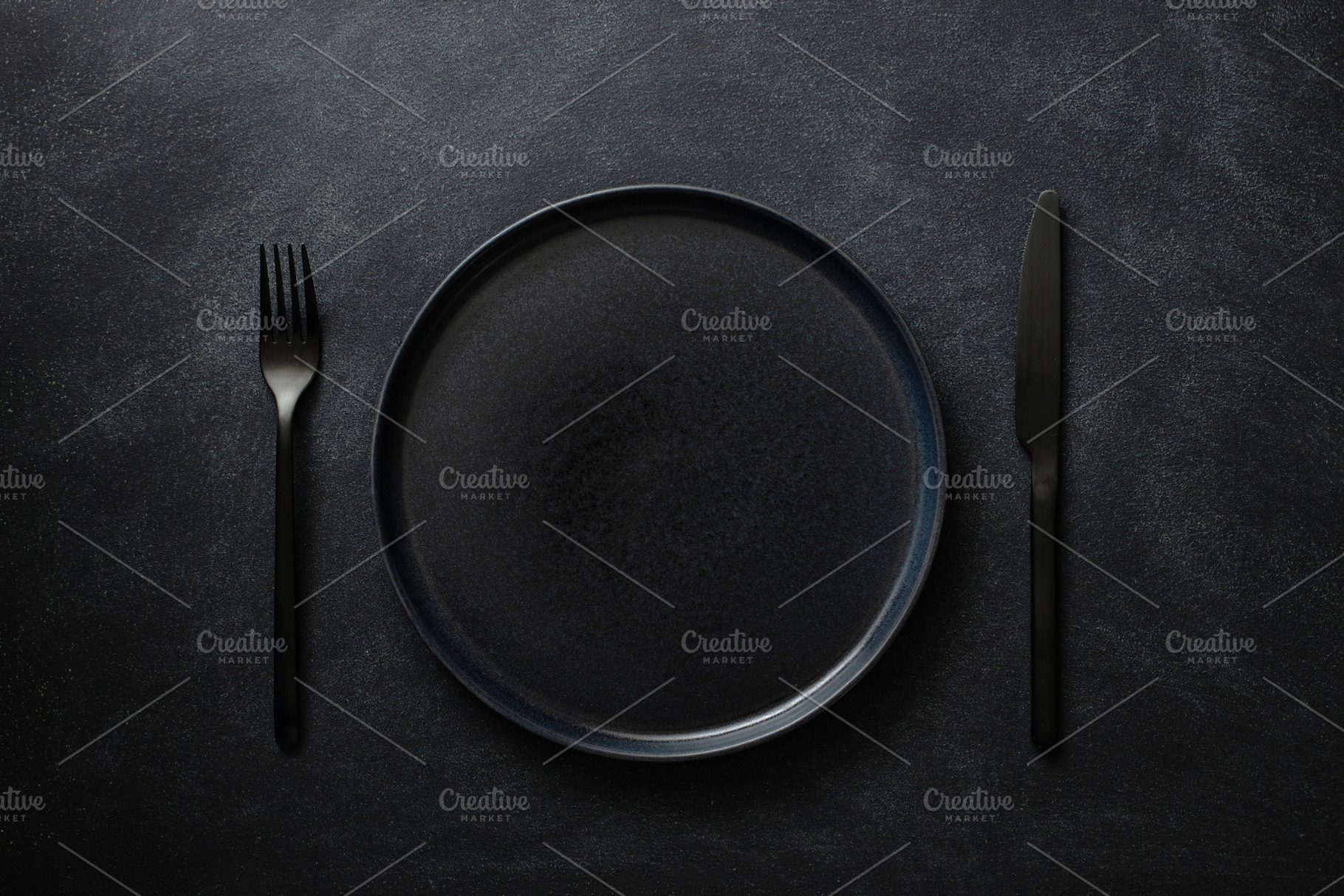 Empty black plate with cutlery, a Food & Drink Photo by Olga_Z