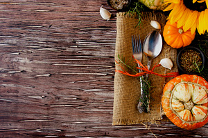 Seasonal wooden table setting with small pumpkins stock photo containing